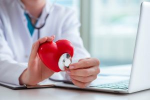 doctor checking up heart